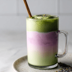 Iced lavender matcha latte with floral cold foam in glass