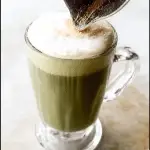 Sea Salt Matcha Latte in glass with foam and salt