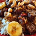 Beef and banana curry served over rice with cashews