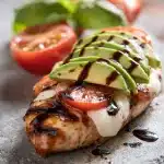 Grilled California Avocado Chicken: juicy chicken breast topped with avocado, mozzarella, tomato, basil, and balsamic glaze.