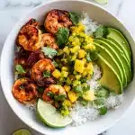 Grilled Shrimp & Avocado Bowls with Mango Salsa: chili-lime shrimp over rice, avocado fans, mango salsa, cilantro, lime.
