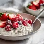High fiber overnight oats in a mason jar topped with raspberries and chia seeds