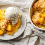 Joanna Gaines peach cobbler golden baked in dish with caramelized peaches