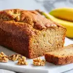 Sliced moist banana bread made with oil instead of butter, showing a tender soft crumb
