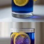 A clear glass of deep indigo butterfly pea flower tea with ice, transforming into vibrant purple as fresh lemon juice is squeezed from a bright yellow citrus wheel garnish, set against a light, airy background.