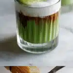 A clear glass on a bright white marble surface containing a layered dirty matcha latte. The bottom layer is vibrant green ceremonial grade matcha, topped with dark espresso and frothy milk, with condensation on the glass.