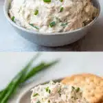 A minimalist white bowl filled with a creamy, textured high protein tuna dip, generously topped with freshly snipped green chives. The bowl sits on a light wood surface, with scattered cucumber slices and celery sticks framing the composition in soft natural light.