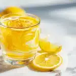Warm honey trick recipe for memory in a glass mug with lemon and cayenne.