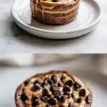 A decadent chocolate protein mug cake in a white ramekin, topped with melting dark chocolate chips and a glossy peanut butter swirl, resting on a white marble surface with a spoon nearby.